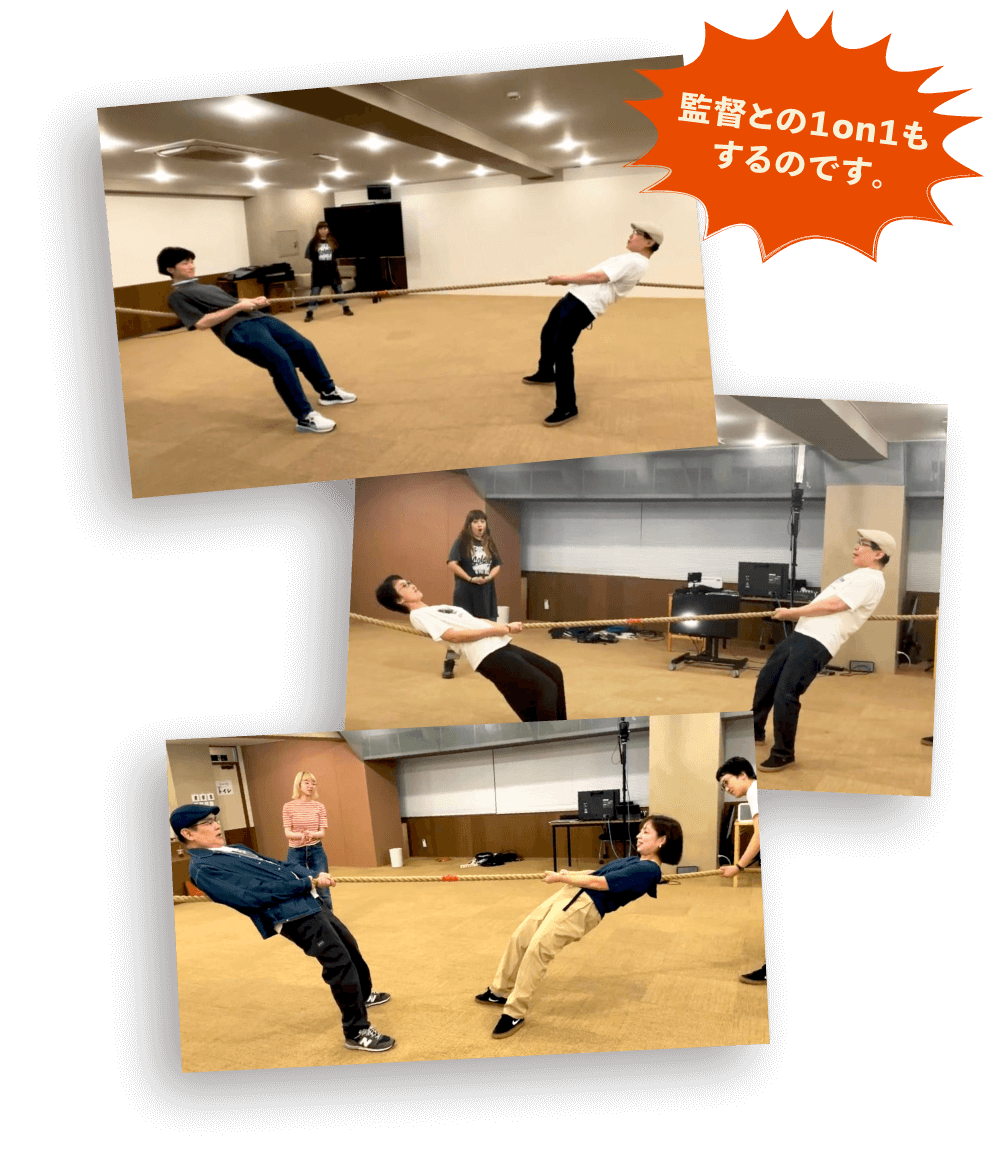 山下監督と１対１で綱を引き合っています。