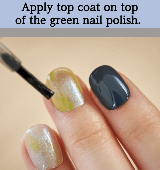 Apply top coat on top of the green nail polish.