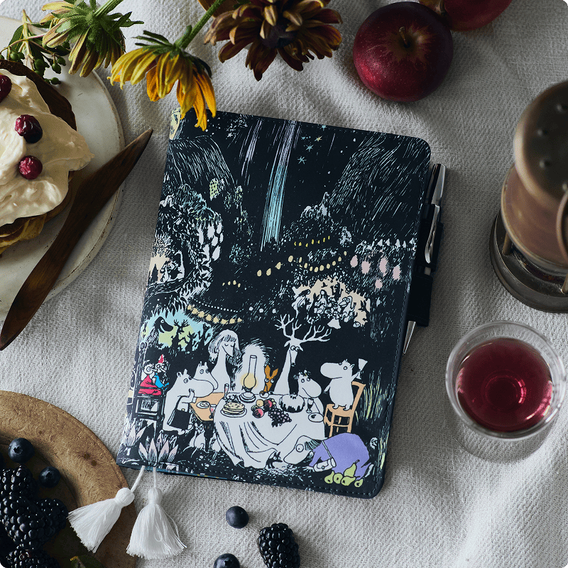 An aerial view of waves crashing against a shore.